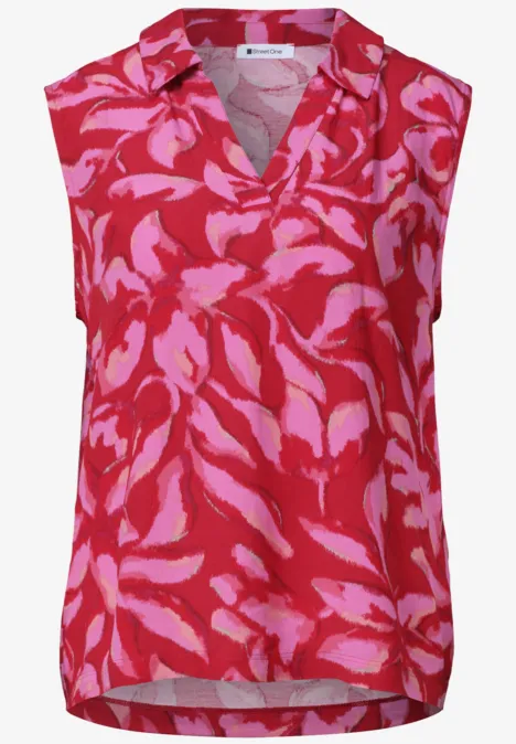 Top avec col fendu et mélange de structures salsa red Débardeur féminin rouge à col V avec motif floral abstrait rose.