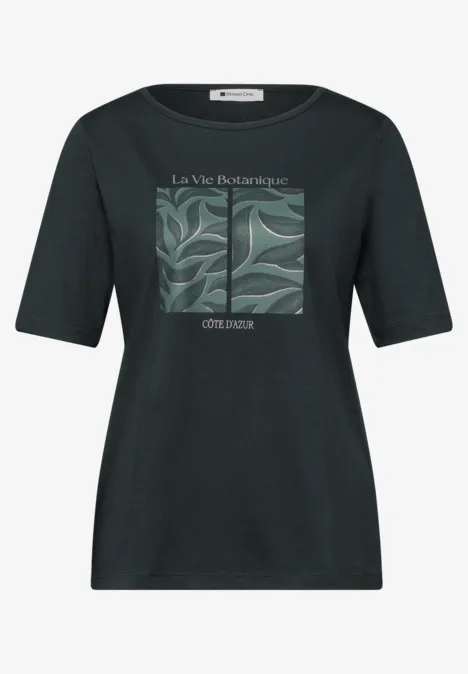 Zwart T-shirt met groen bladmotief in een kader en tekst "La Vie Botanique" en "CÔTE & DAX"