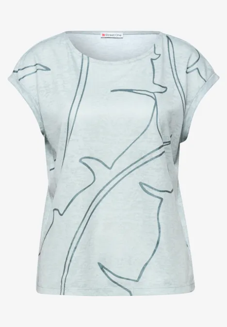 T-shirt gris clair à manches courtes avec motif abstrait de branches, coupe décontractée aux épaules tombantes.