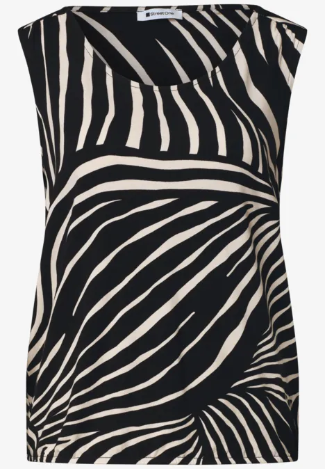 Top met V-hals en elastische zoom Black Mouwloze, losvallende top met beige zebraprint op zwarte achtergrond.