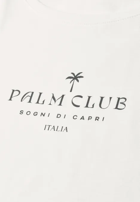 Shirt met hangende schouder en tekst off white Wit T-shirt met palmboomlogo en tekst 'PALM CLUB SOGNI DI CAPRI ITALIA'.