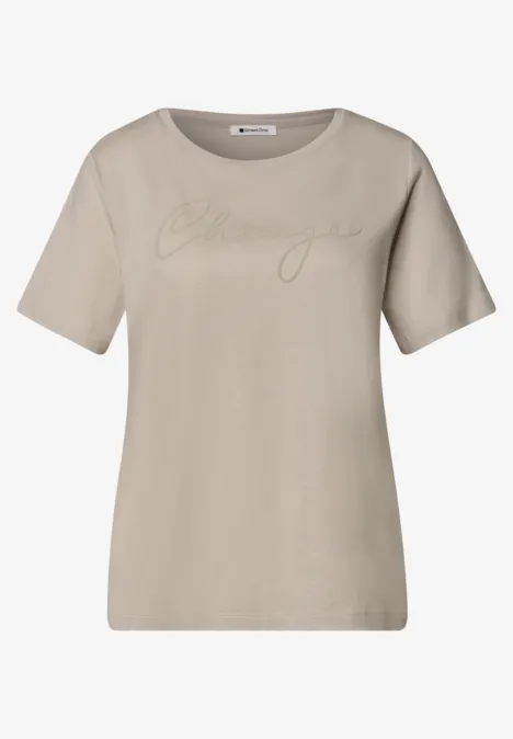 T-shirt à col rond avec wording artwork clay sand T-shirt beige à col rond et manches courtes, détail imprimé ton sur ton sur le devant.