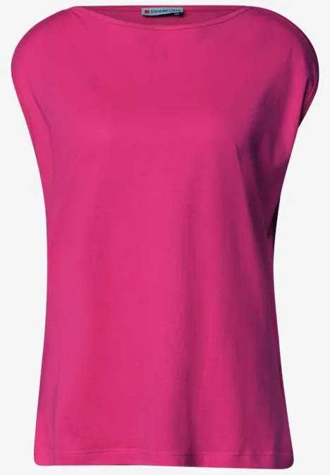 T-shirt sans manches fuchsia, coupe ample, col rond large, uni et épuré.
