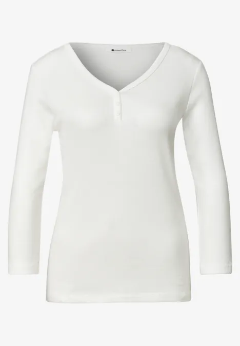 Wit damesshirt met lange mouwen, V-hals en knoopsluiting