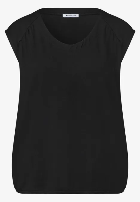 Effen zwarte dames top met korte mouwen en ronde hals.