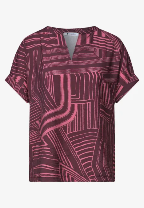 T-shirt manches courtes rose et noir avec motif géométrique et encolure fendue