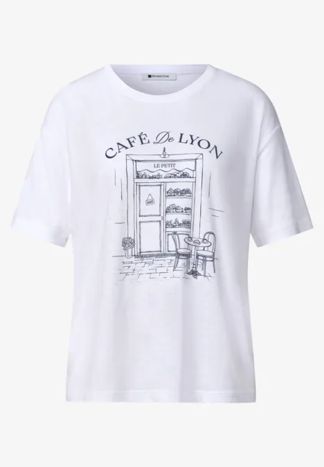 T-shirt blanc avec croquis d'un café 'Café de Lyon' et scène de rue