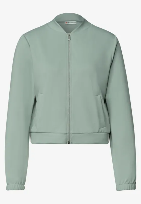 Jas met lange mouwen en een korter model eucalyptus green Lichtgroene bomberjack met rits, lange mouwen en zijzakken.