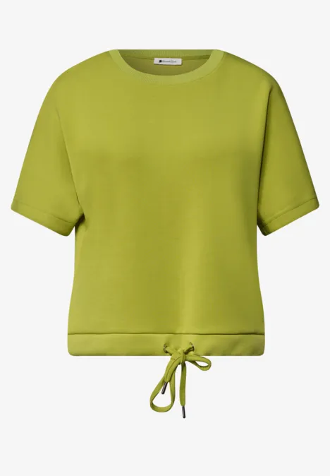 Hellgrünes, kurzärmliges T-Shirt mit Rundhalsausschnitt und Kordelzug am Saum.