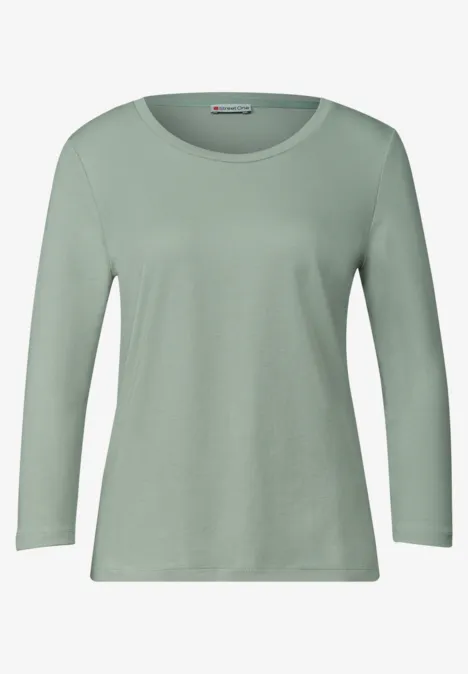 Ein schlichtes, langärmliges T-Shirt in hellem Mintgrün.