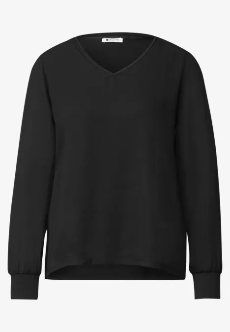 Schwarzer Pullover mit V-Ausschnitt und langen Ärmeln