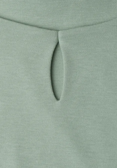 Tissu vert pâle avec petite découpe en goutte