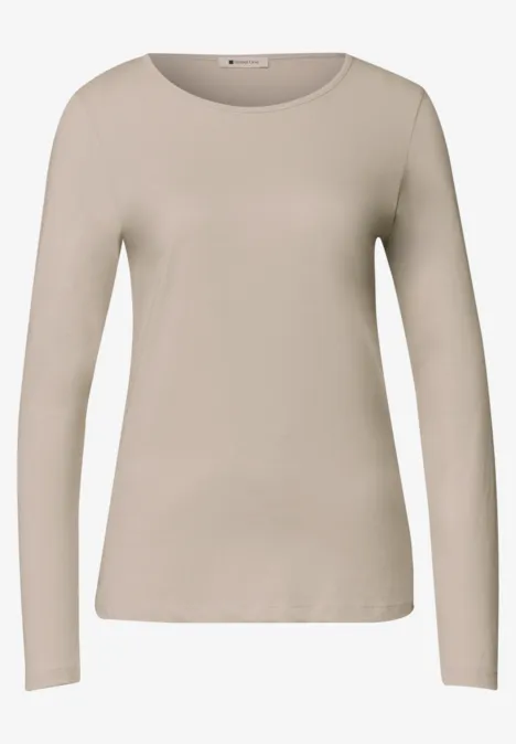 Beiges Langarmshirt mit Rundhalsausschnitt, schmaler Passform für Damen.