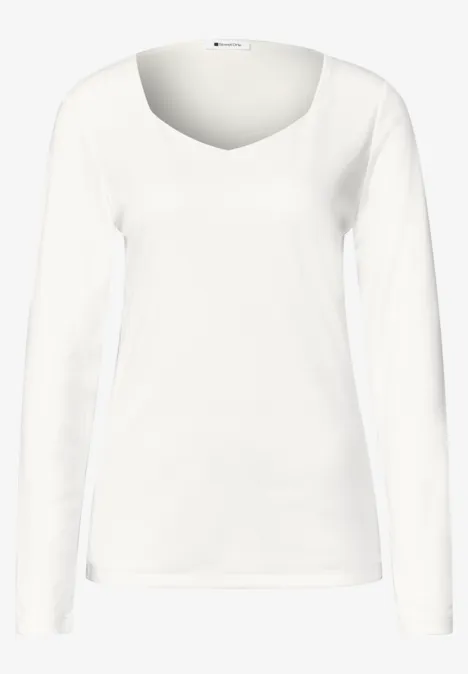 T-shirt femme blanc à manches longues et col rond.