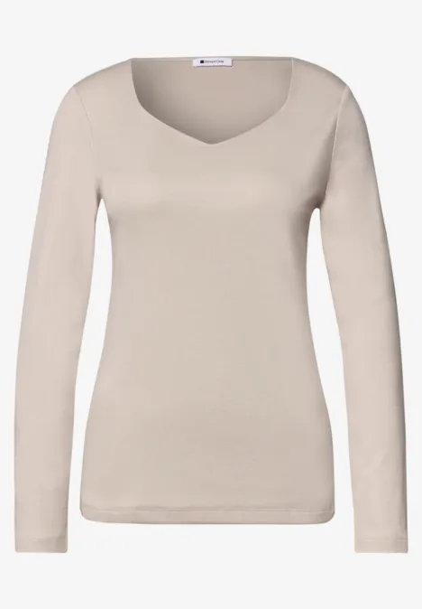 T-shirt à manches longues pour femme, beige, col rond, style épuré.