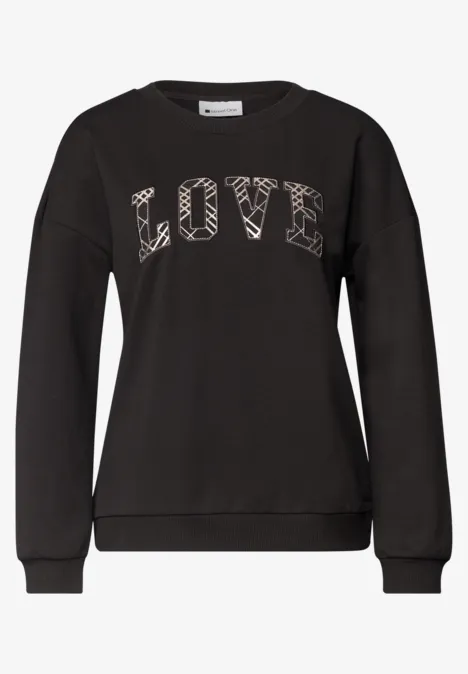 Langarm Shirt mit Wording Artwork black coffee Schwarzer Pullover mit aufgedrucktem 'LOVE'-Schriftzug in gemusterten Buchstaben.