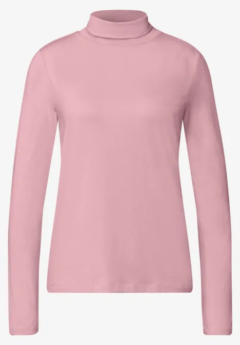 Rosa Rollkragenpullover mit langen Ärmeln und schlichter Optik.