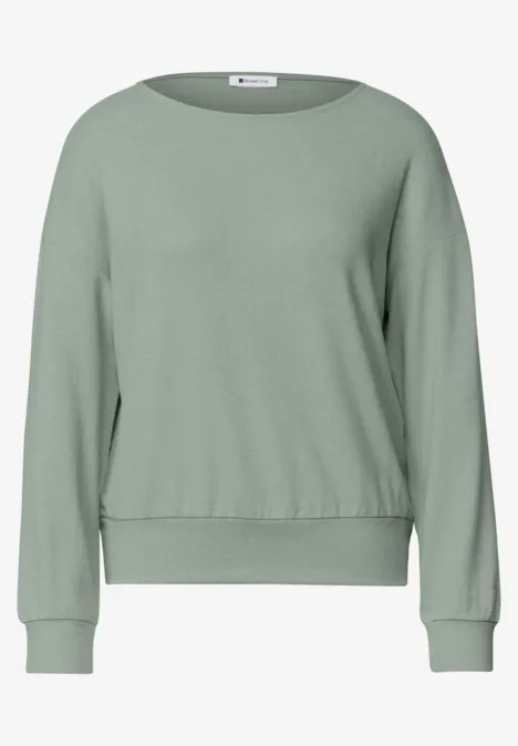 Schlichtes, hellgrünes Sweatshirt mit Rundhalsausschnitt und langen Ärmeln.