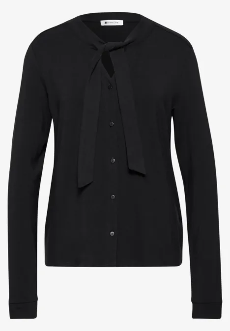 Schwarze Strickjacke mit langen Ärmeln und Bindeschleife am Kragen.