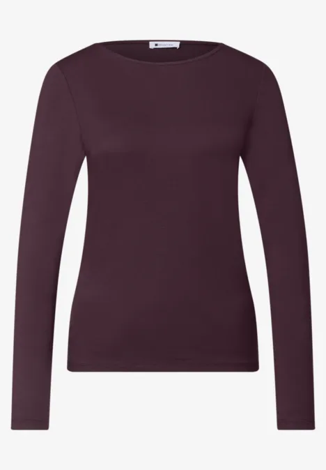 Paars dameslongsleeve met ronde hals en getailleerde pasvorm.