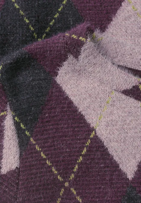 Strickstoff mit Argyle-Muster in Lila, Pink und Schwarz, verziert mit neongrünen Nahtlinien.
