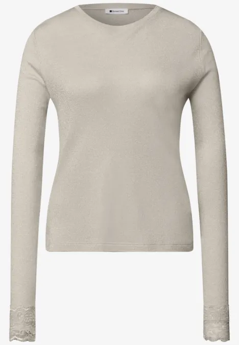 T-shirt à manches longues avec paillettes et dentelle pure beige Schlichtes beige Langarmshirt mit Rundhalsausschnitt und zartem Spitzensaum an den Ärmeln.