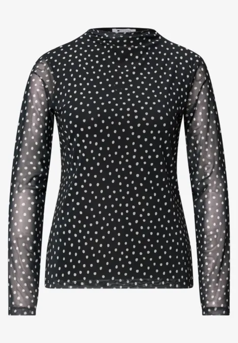 Schwarzes, langärmliges Mesh-Oberteil mit weißen Polka-Dots und Rundhalsausschnitt.
