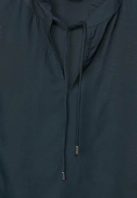 Mouwloze blouse met ruches. cool vintage green