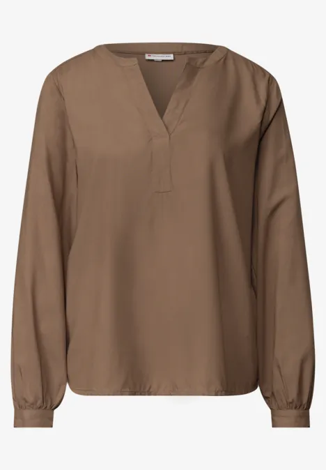 Tuniek met V-hals sanded amber Braune Bluse mit V-Ausschnitt und langen Ärmeln, locker sitzend.