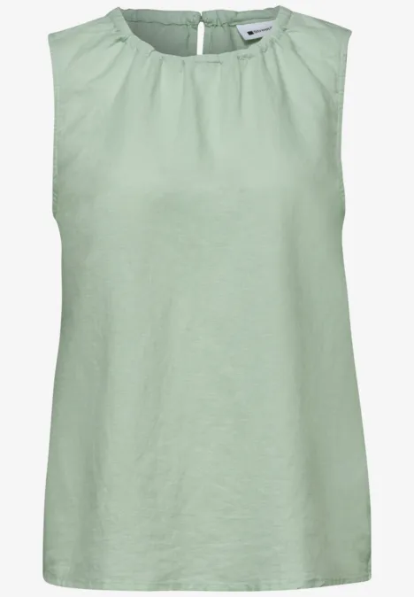 Ärmelloses mintgrünes Top aus Leinen mit rundem Halsausschnitt.