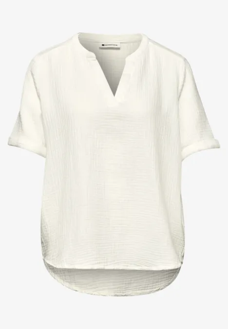Blouse met korte mouwen in mousseline kwaliteit off white Blouse met korte mouwen in mousseline kwaliteit off white