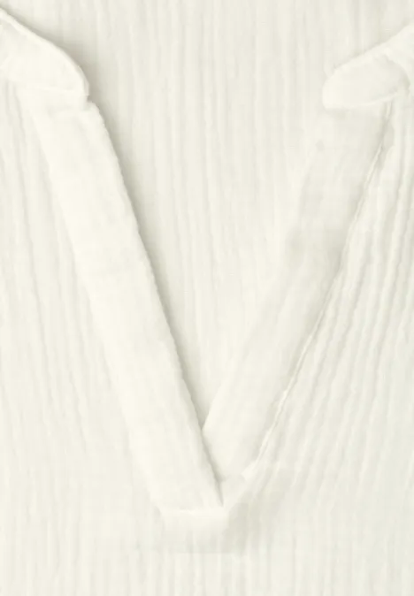 Blouse met korte mouwen in mousseline kwaliteit off white Blouse met korte mouwen in mousseline kwaliteit off white