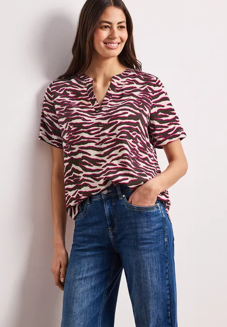 Blouse à manches courtes avec split neck et imprimé minimal rose