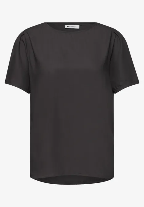 Schwarzes Damenshirt mit kurzem Ärmel, einfacher Rundhalsausschnitt und leicht verlängertem Rücken.