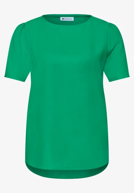 Blouse met ronde hals en korte pofmouwen ever green Een effen groen T-shirt met korte mouwen, ronde hals en iets langer rugpand.