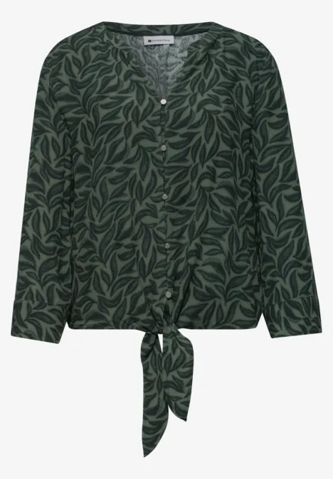 Donkergroen blouse met bladmotief, lange mouwen, knoopsluiting en vooraan een strik.