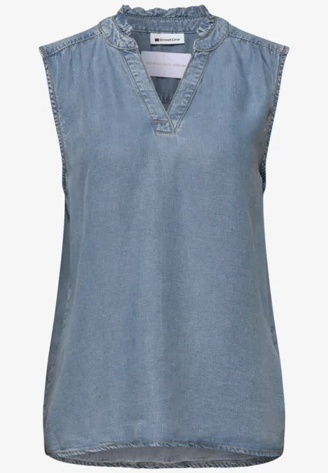 Mouwloze denim top met V-hals en sierlijke ruches aan de kraag.