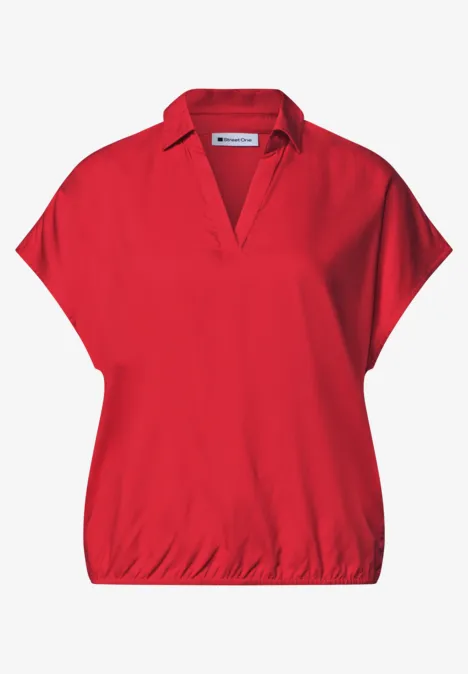 Rotes Damen-Shirt mit V-Ausschnitt, überschnittenen Schulterärmeln und elastischem Saum.