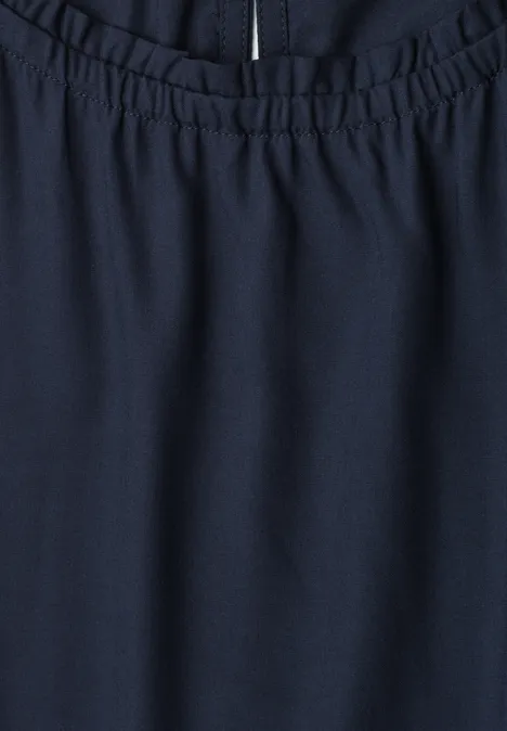 Dunkelblaue Hose mit elastischem Bund und sichtbarem Reißverschluss oben.