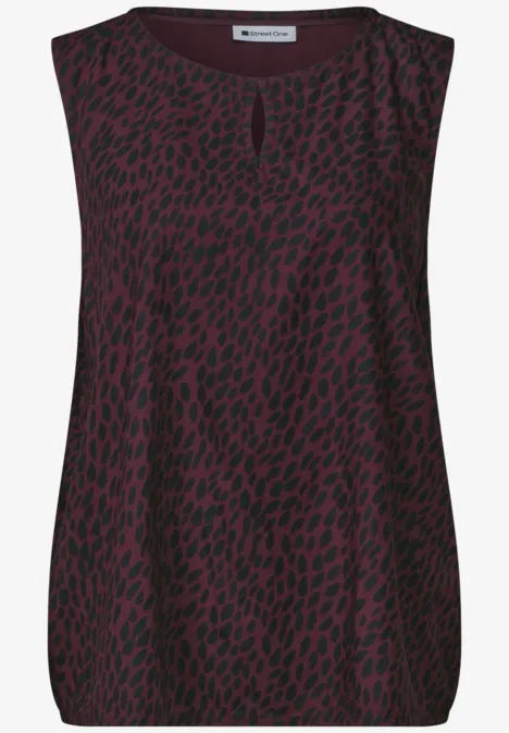 Top sans manches pour femme, rouge sombre avec motif léopard noir.