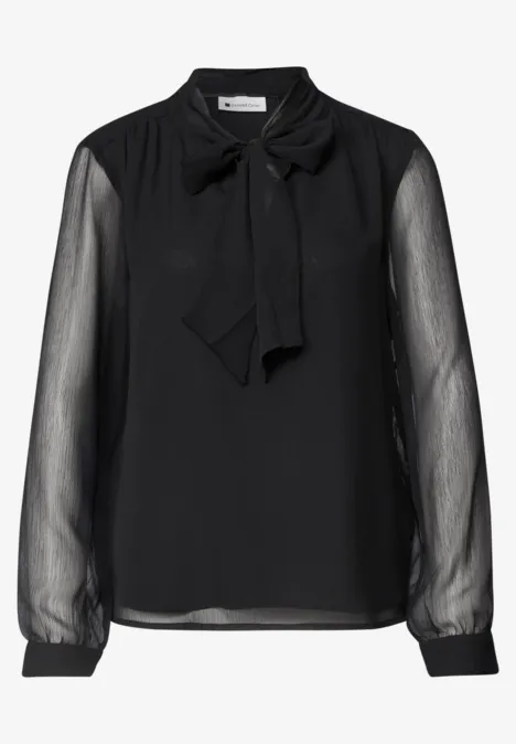 Schwarze Bluse mit transparenten Ärmeln und Schleifenkragen.
