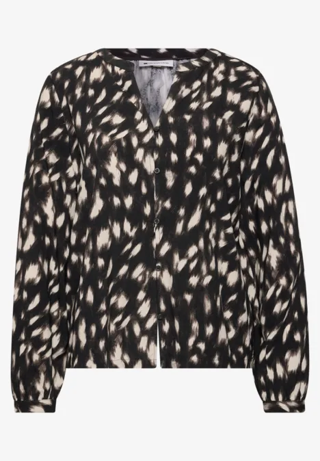 Blouse légère pour femme à motif tacheté noir et beige, col V et manches longues.