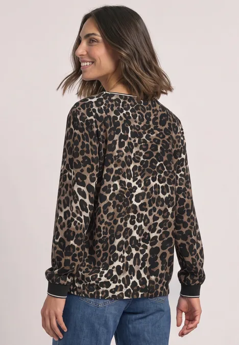 Chemisier à manches longues avec détails en bande et imprimé léopard Black Frau in Leoparden-Print-Pullover und Jeans, von hinten fotografiert, lässiger Look.