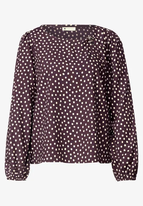 Chemisier à col rond et détail à boucles berry plum Langärmlige Bluse in dunklem Lila mit weißen Punkten.