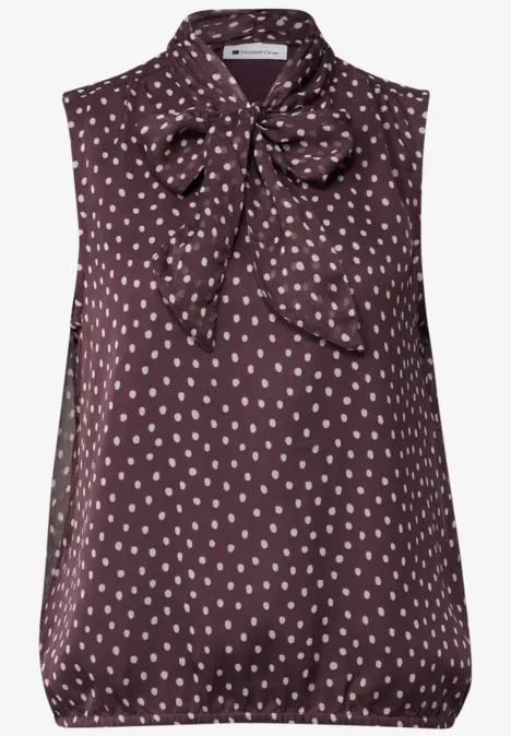 Haut-blouse en chiffon avec nœud décoratif berry plum Top sans manches bordeaux à petits pois blancs avec nœud décoratif au col.