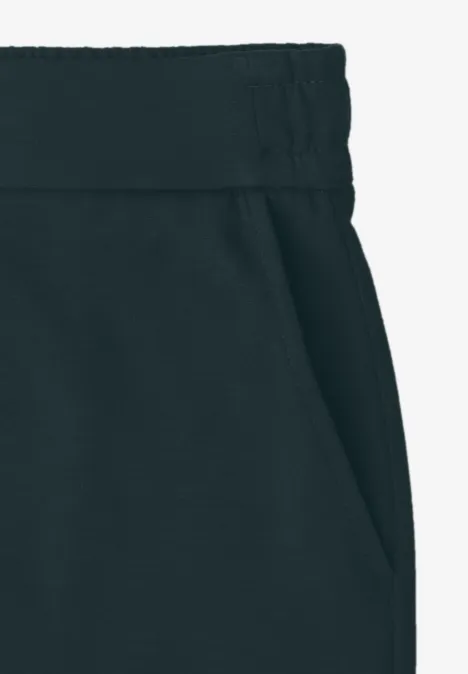 Donkere joggingbroek met elastische taille en zijzak.