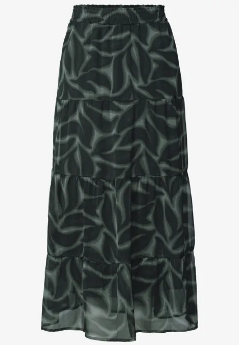 Zwarte maxirok met groen bladerenpatroon, elastische taille.