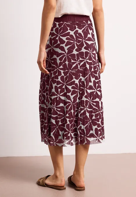 Dames midi-rok bordeauxrood met witte bladerenprint, losvallend, rugaanzicht.