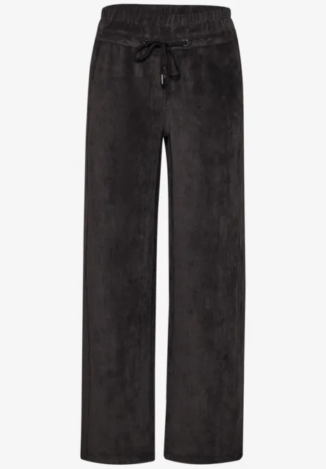 Schwarze, locker geschnittene Cordhose mit elastischem Bund und Kordelzug.
