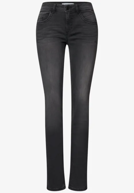 Schwarze Slim-Fit-Damenjeans mit mittlerer Taille, fünf Taschen und leichtem Used-Look.